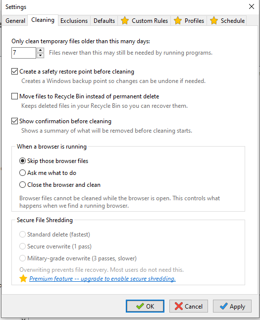RJL System Cleaner Settings dialog on the Cleaning tab showing a temp file age spinner set to 7 days, a safety restore point checkbox, a Recycle Bin option, browser behavior radio buttons, and a grayed-out Secure File Shredding section marked as a premium feature